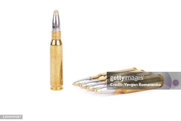 .308 or 7.62 caliber bullets isolated on white background - bullets stock-fotos und bilder