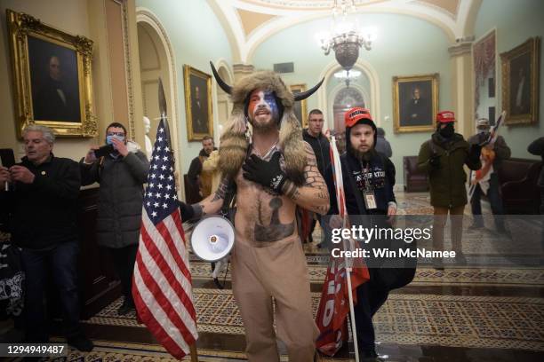 Pro-Trump mob confronts U.S. Capitol police outside the Senate chamber of the U.S. Capitol Building on January 6, 2021 in Washington, DC. Congress...