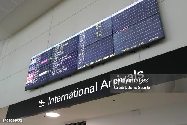 Digital screen displays flight arrival times at Brisbane Airport on January 07, 2021 in Brisbane, Australia. Flight NZ147 is the first 'safe travel...