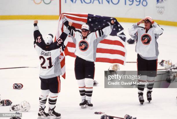 The USA Women's Ice Hockey team celebrates winning the Olympic gold medal match against Canada during the 1998 Winter Olympics on February 17, 1998...