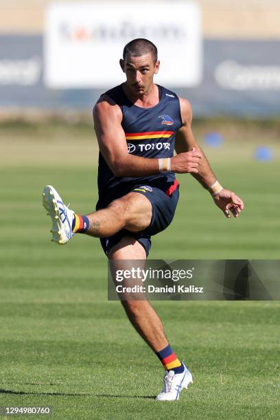 Taylor Walker of the Crows kicks the ball during an Adelaide Crows AFL training session at Westlakes on January 07, 2021 in Adelaide, Australia.