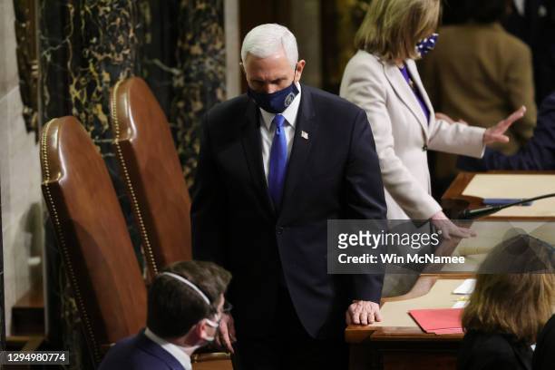 Vice President Mike Pence returns to Senate chamber to debate the Pennsylvania objection in the House Chamber during a reconvening of a joint session...