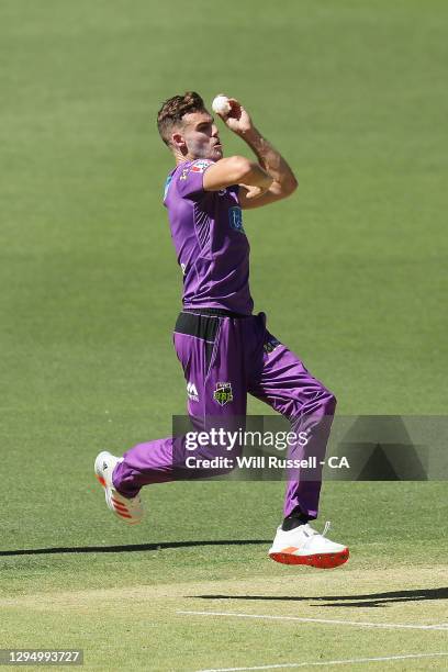 Nick Winter of the Hurricanes bowls during the Big Bash League match between the Hobart Hurricanes and the Sydney Thunder at Optus Stadium, on...