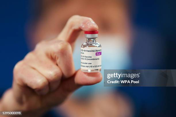 Healthcare worker holds a vial of AstraZeneca coronavirus disease vaccine at the Pentland Medical Practice on January 7, 2021 in Currie, Scotland....