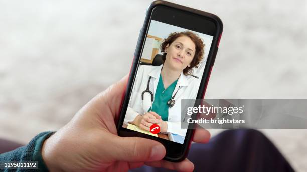 online doctor appointment - remote location phone stock pictures, royalty-free photos & images