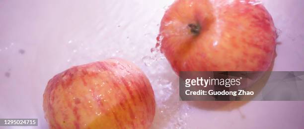 water - apple water splashing stock pictures, royalty-free photos & images