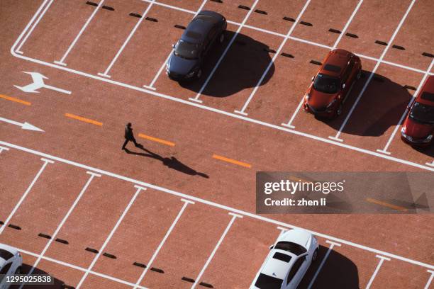 high angle shot of empty parking lot - ev parking space stock pictures, royalty-free photos & images