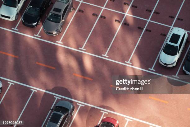 high angle shot of empty parking lot - ev parking space stock pictures, royalty-free photos & images
