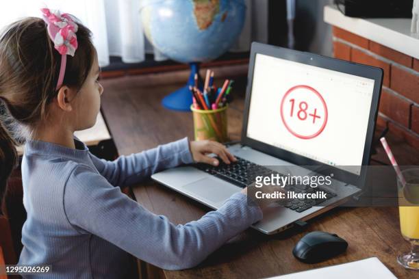 child girl using computer ended up 18+ web page on internet, parental control concept - guarding stock pictures, royalty-free photos & images