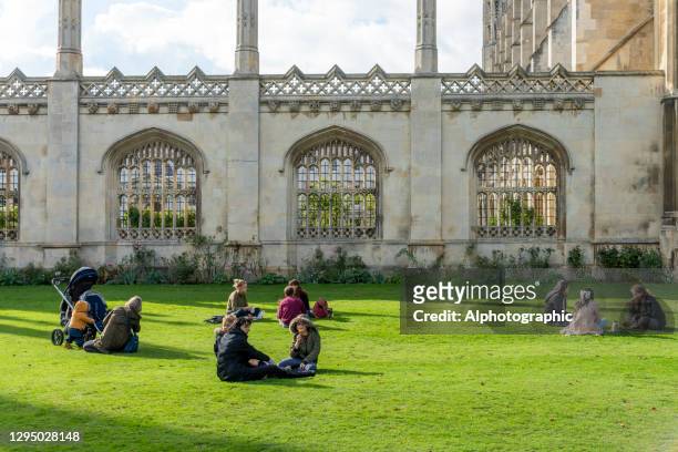 tourist's and students outside king's college chapel, cambridge. - university student picnic stock pictures, royalty-free photos & images