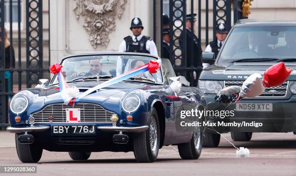 Prince William, Duke of Cambridge and Catherine, Duchess of Cambridge leave Buckingham Palace on route to Clarence House, driving Prince Charles,...