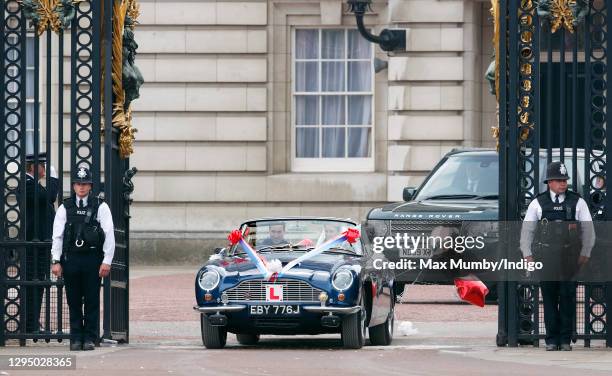 Prince William, Duke of Cambridge and Catherine, Duchess of Cambridge leave Buckingham Palace on route to Clarence House, driving Prince Charles,...