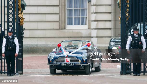 Prince William, Duke of Cambridge and Catherine, Duchess of Cambridge leave Buckingham Palace on route to Clarence House, driving Prince Charles,...
