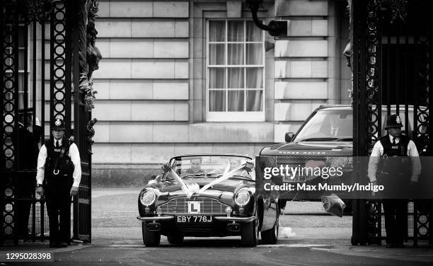 Prince William, Duke of Cambridge and Catherine, Duchess of Cambridge leave Buckingham Palace on route to Clarence House, driving Prince Charles,...