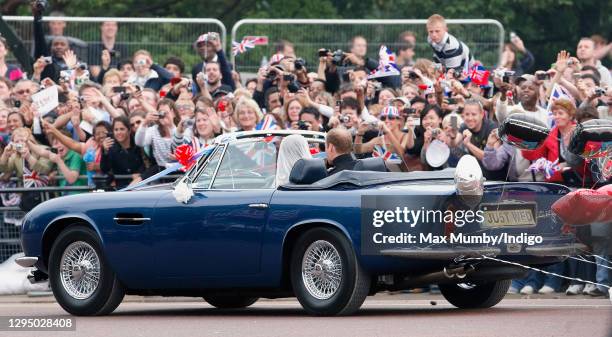 Prince William, Duke of Cambridge and Catherine, Duchess of Cambridge leave Buckingham Palace on route to Clarence House, driving Prince Charles,...