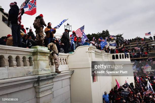 Thousands of Donald Trump supporters storm the United States Capitol building following a "Stop the Steal" rally on January 06, 2021 in Washington,...