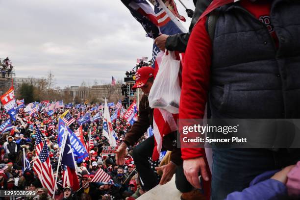 Thousands of Donald Trump supporters storm the United States Capitol building following a "Stop the Steal" rally on January 06, 2021 in Washington,...