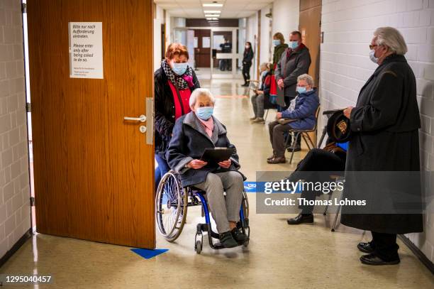 The 101 years old Edith Lohmueller gets vaccinated against Covid-19 with the Pfizer/BioNTech vaccine at a vaccine center set up in a former college...