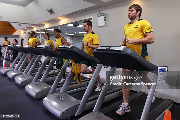 Ben McCalman and Pat McCabe of the Wallabies jog on a running machine during an Australia IRB Rugby World Cup 2011 recovery session at North Shore...