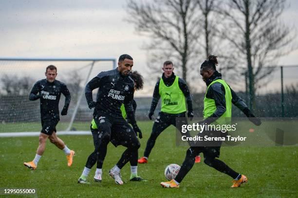 Callum Wilson and Christian Atsu run to the ball during the Newcastle United Training Session at the Newcastle United Training Centre on January 07,...