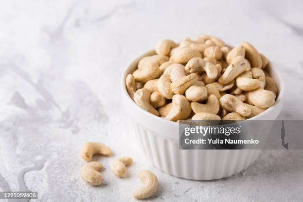 raw cashew nuts. superfood. - cashew stock pictures, royalty-free photos & images