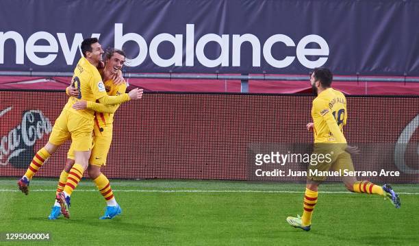Lionel Messi of Barcelona celebrates with Antoine Griezmann and Jordi Alba of Barcelona after scoring his sides third goal during the La Liga...