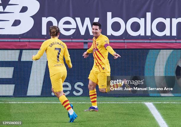 Lionel Messi of Barcelona celebrates with Antoine Griezmann of Barcelona after scoring his sides third goal during the La Liga Santander match...