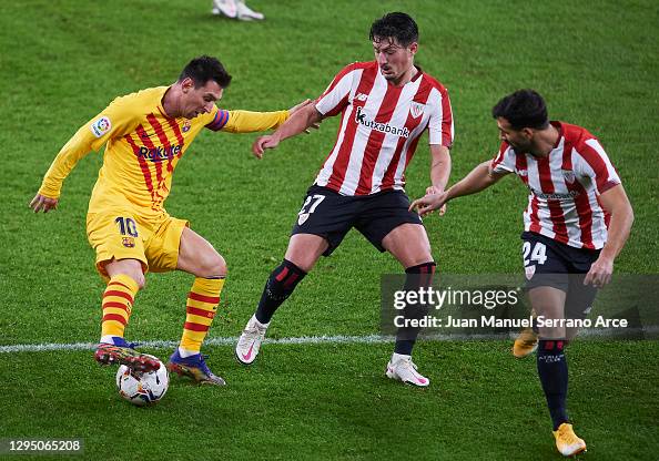 Lionel Messi of FC Barcelona duels for the ball with Unai Vencedor of