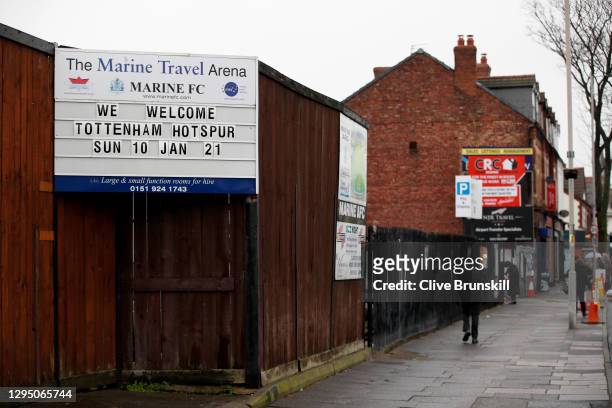 Photograph of Marine Football Club's board outside their Marine Travel Arena ground with a board displaying their next home game the FA Cup Third...