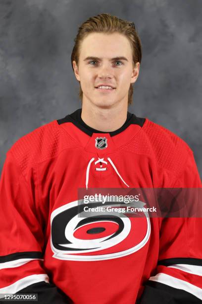 Jake Bean of the Carolina Hurricanes poses for his official headshot of the 2020-2021 season on January 3, 2021 at PNC Arena in Raleigh, North...