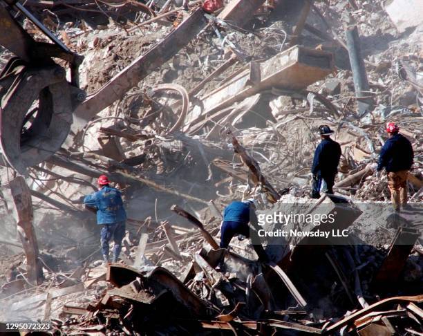 Workers continue to clean up the rubble and wreckage and ground zero at the World Trade Center on October 18, 2001 after the terrorist attacks on...