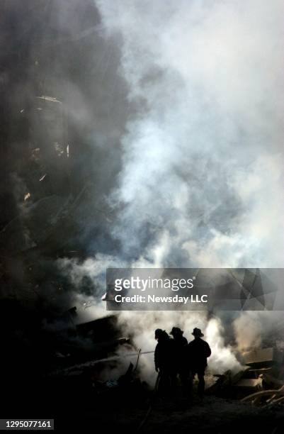 Smoke rises at ground zero at the site of the September 11 World Trade Center terrorist attack on October 18, 2001 in Lower Manhattan, New York. A...
