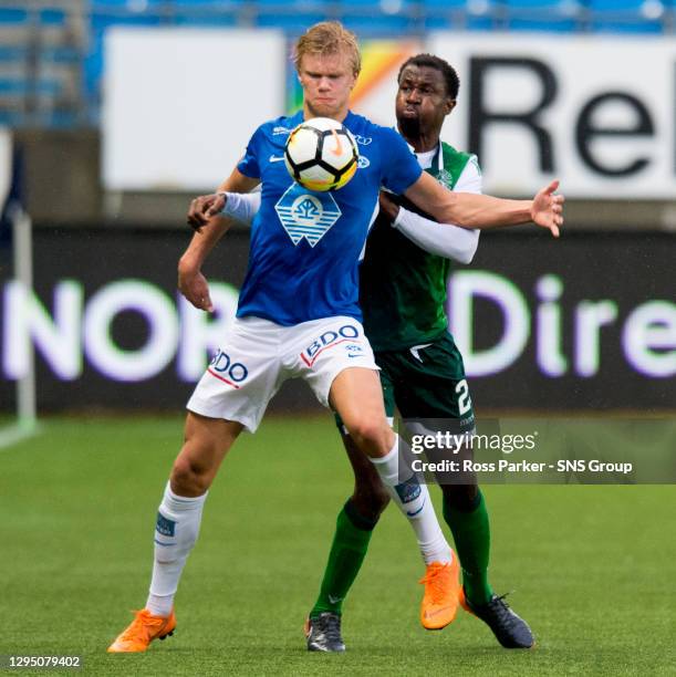 Molde's Erling Braut Haland holds off Hibernian's Efe Ambrose