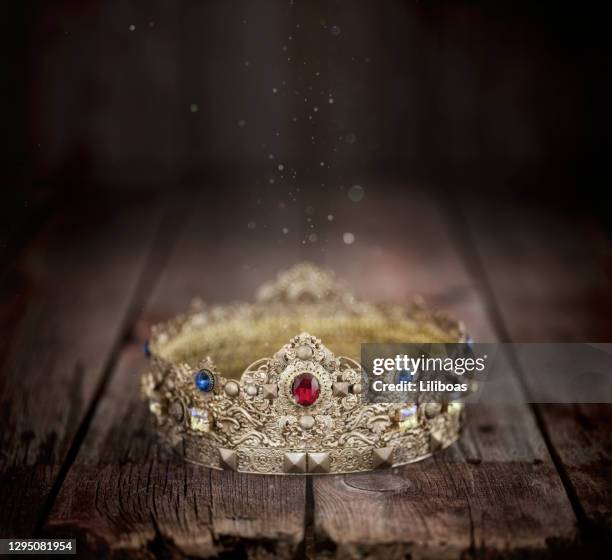 gold crown on an old wood background - gold crown stock pictures, royalty-free photos & images