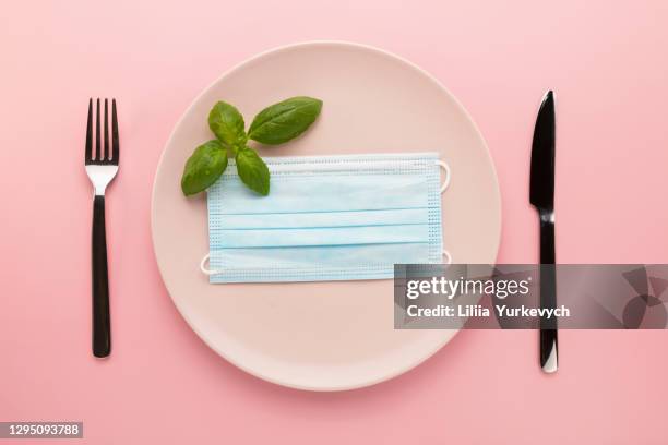 conceptual photo of the impact of covid-19 on the restaurant business. - ruined dinner stock pictures, royalty-free photos & images