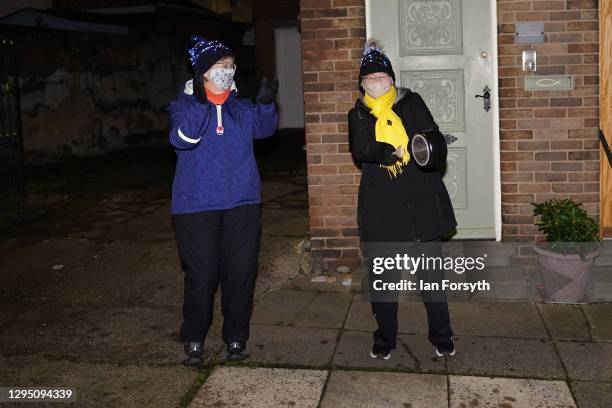 Two women who live together stand outside their home in Saltburn and take part in the Clap for Heroes event on January 07, 2021 in Saltburn By The...