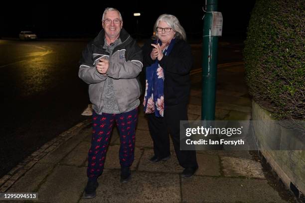 Couple join with other residents of a street in Saltburn and take part in the Clap for Heroes event on January 07, 2021 in Saltburn By The Sea,...