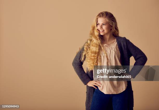 gorgeous female girl in trendy wear in studio - andersdahl65 stock pictures, royalty-free photos & images