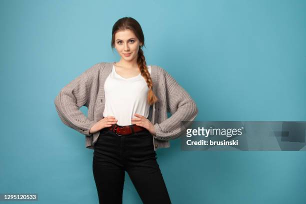 studio portrait of 18 year old woman with brown hair - woman waist up stock pictures, royalty-free photos & images