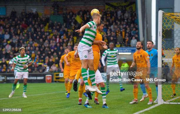 V CELTIC.TONY MACARONI ARENA - LIVINGSTON .Celtic's Kristoffer Ajer challenges for a header and ends up with a facial injury