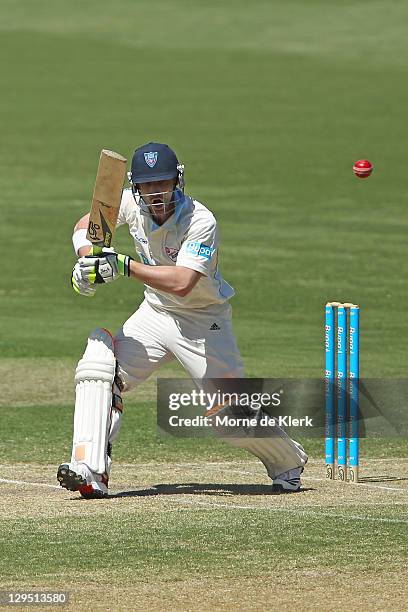 Phil Hughes of the Blues bats during day two of the Shieffield Shield match between the South Australia Redbacks and the New South Wales Blues at...