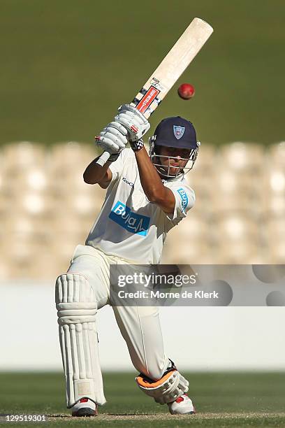 Usman Khawaja of the Blues bats during day two of the Shieffield Shield match between the South Australia Redbacks and the New South Wales Blues at...
