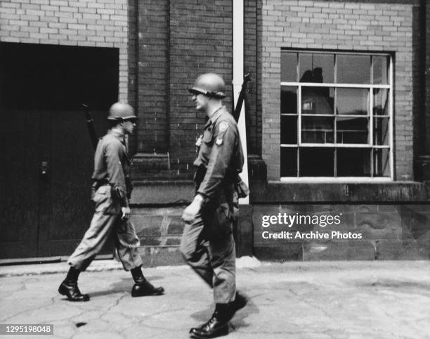 Armed officers of the National Guard patrol the streets during the race riots in Newark, New Jersey, July 1967. The Newark riot started after cab...