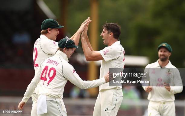 Pat Cummins and Cameron Green of Australia celebrates after taking the wicket of Shubman Gill of India during day two of the 3rd Test match in the...