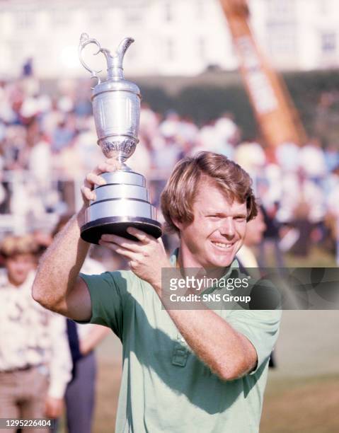 Tom Watson celebrates with the Claret Jug after winning the 1977 Open Championship.