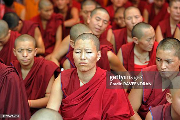 Tibetan Buddhist monks and nuns participate in a sit-in solidarity rally against China's rule on Tibet, in New Delhi on October 18, 2011. Hundreds of...