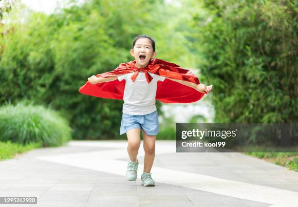 hero girl take off - cosplay stock pictures, royalty-free photos & images