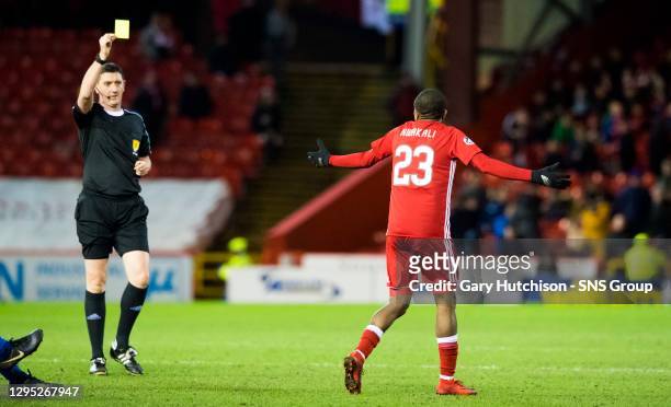 V KILMARNOCK.PITTODRIE.referee Craig Thompson awards Aberdeen's Chidiebere Nwakali a yellow card on his debut
