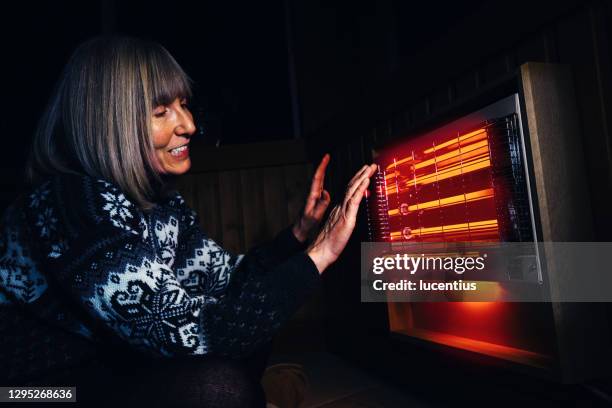 infrared rays are the best - electric fire stock pictures, royalty-free photos & images