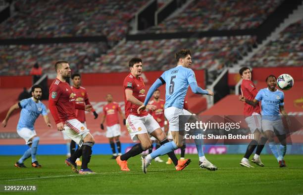 John Stones of Manchester City scores the first goal during the Carabao Cup Semi Final match between Manchester United and Manchester City at Old...